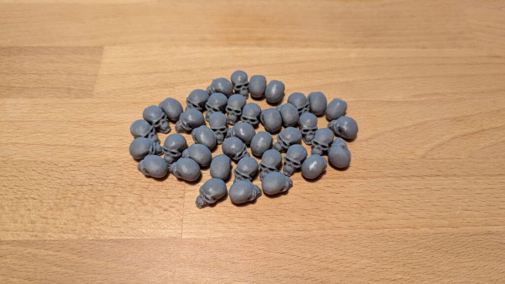 Pool token a forma di teschio per VtES stampati in 3D